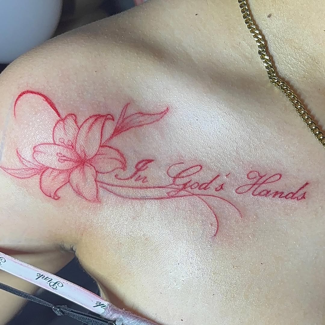 Lily and script lettering fine line tattoo on the shoulder by GasPaccInk