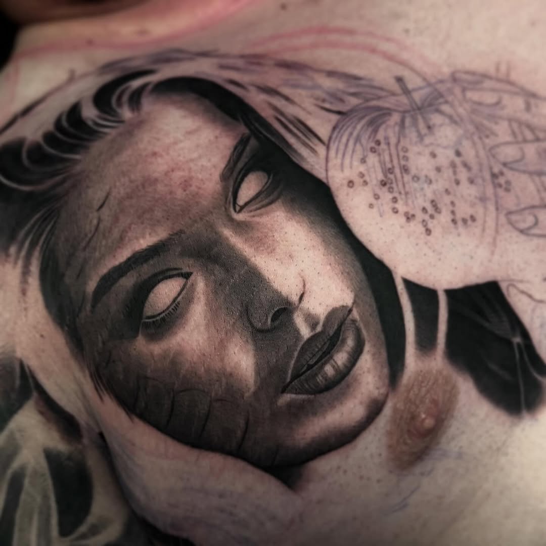 Tattoo by @angel_damiangg — realism, black_and_grey