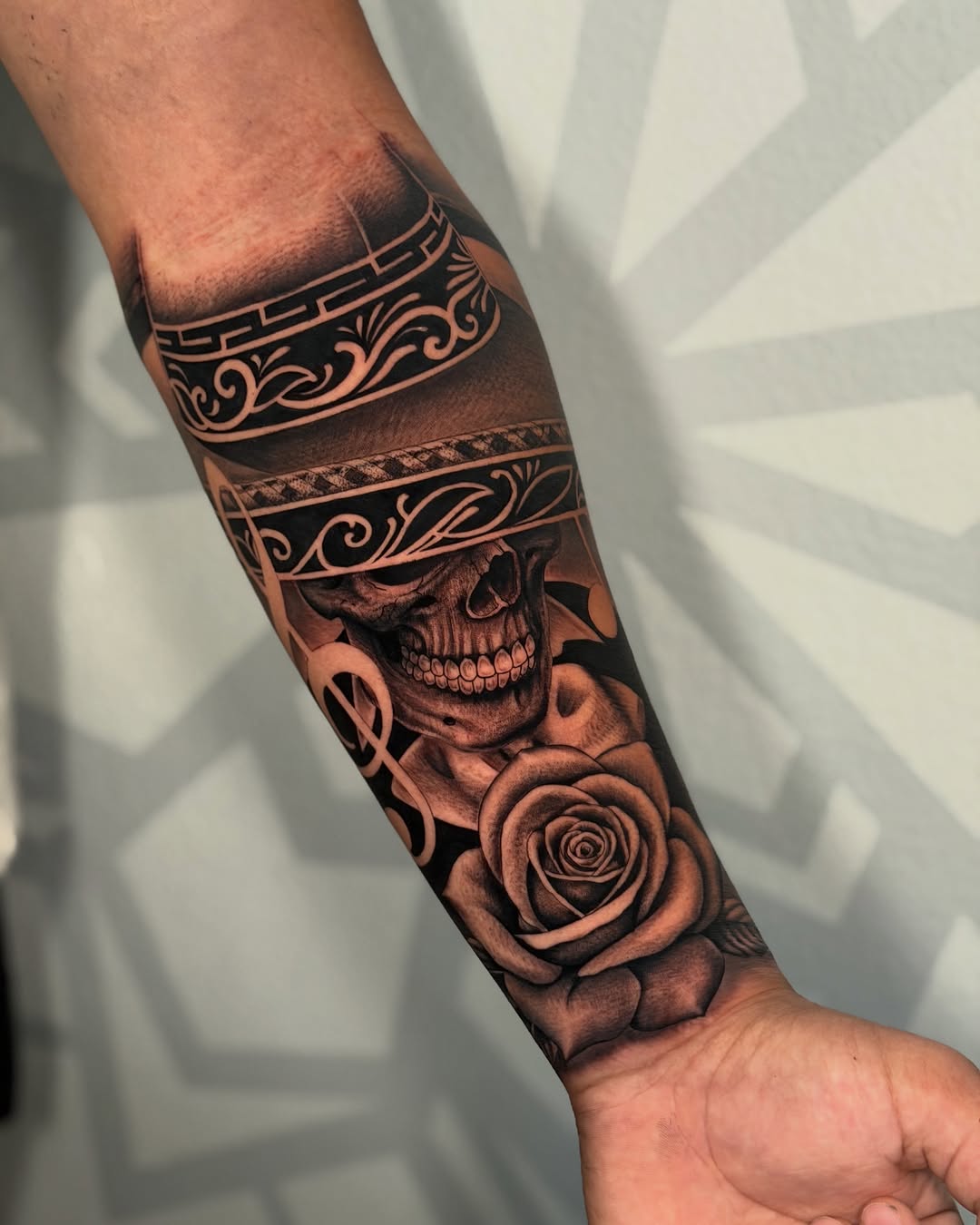 Skull with sombrero and rose realism tattoo on the forearm by Las Vegas Tattoo Artist