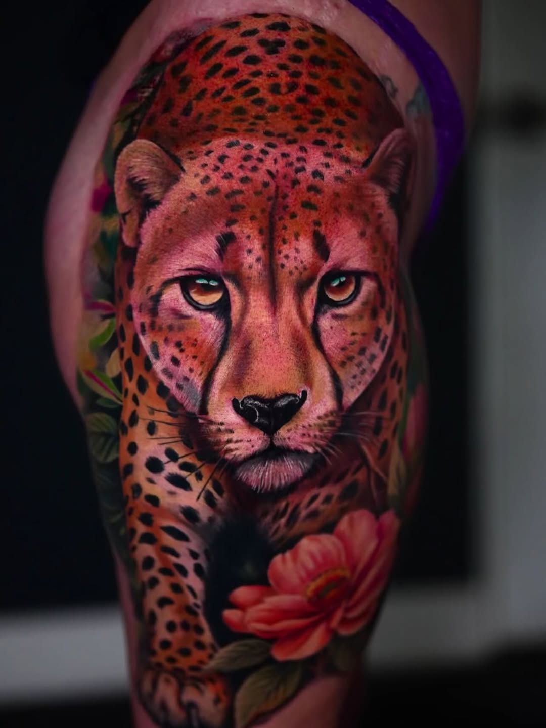 Cheetah and flowers realism tattoo on the forearm by Yasmani ramirez