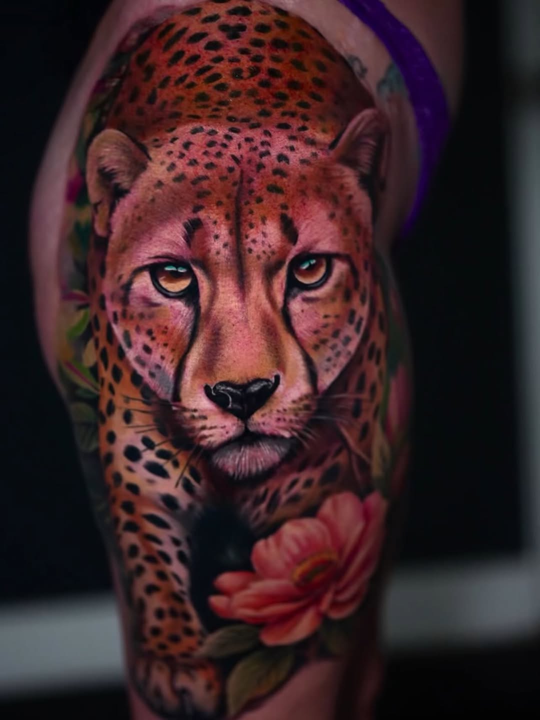 Cheetah with flowers realism tattoo on the forearm by Yasmani ramirez
