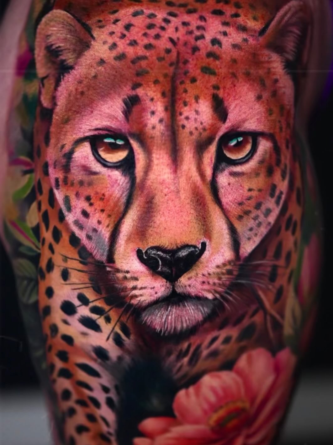 Cheetah portrait with flowers realism tattoo on the forearm by Yasmani ramirez