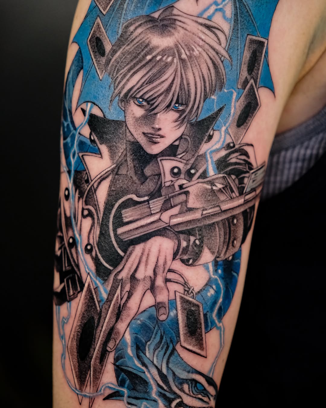 Yu-Gi-Oh character with cards anime tattoo on the forearm by Hemi 혜미타투