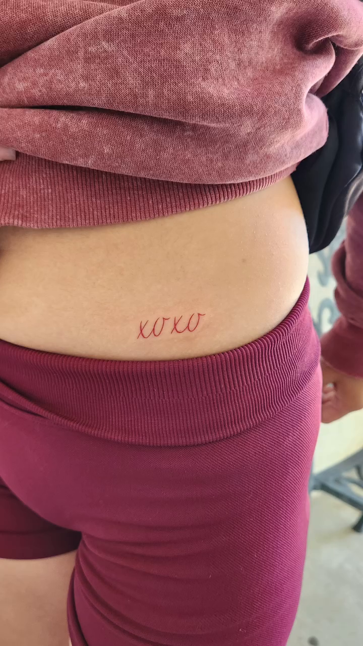XOXO script tattoo lettering tattoo on the thigh by @youxg_guxxz