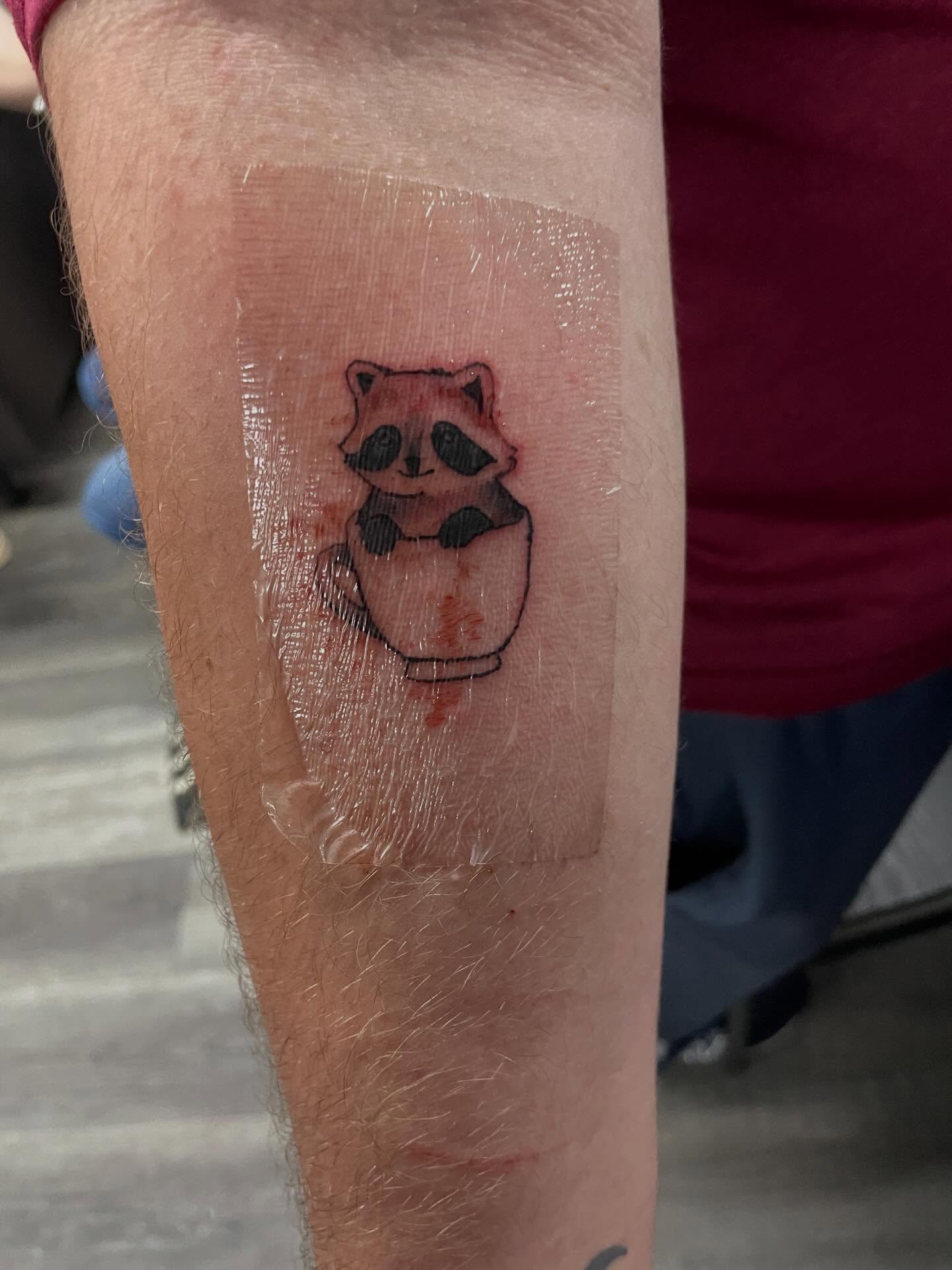 Raccoon American traditional tattoo on the forearm by Yaya tattoo