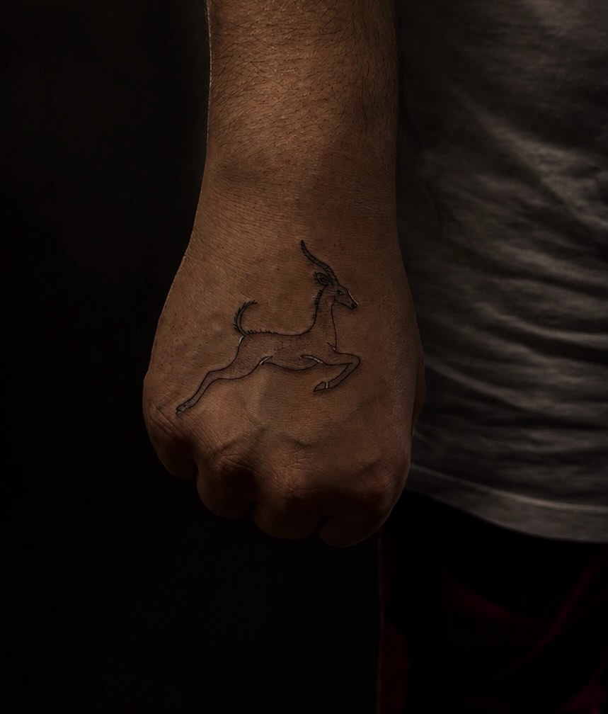 Gazelle fine line tattoo on the hand by @elijahtats
