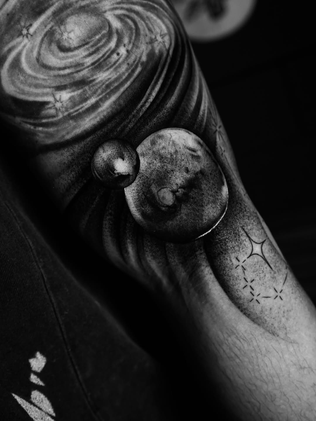 Planets and galaxy surrealism tattoo on the forearm by orlando