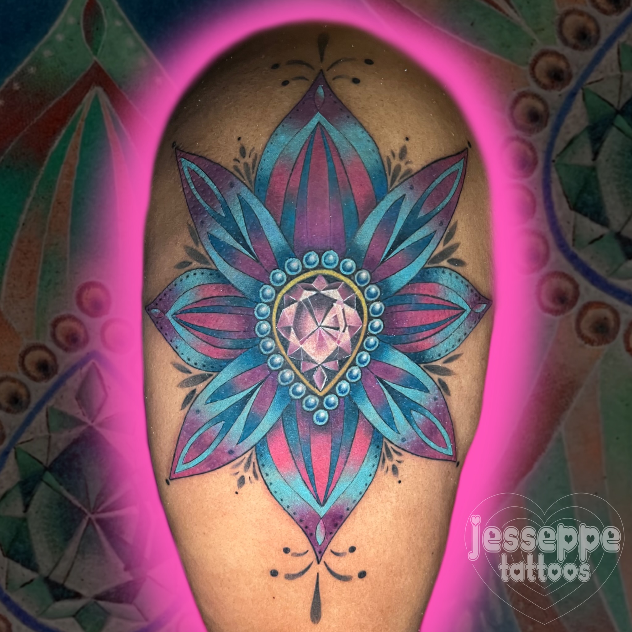 Lotus flower geometric tattoo on the thigh by Jess Watts