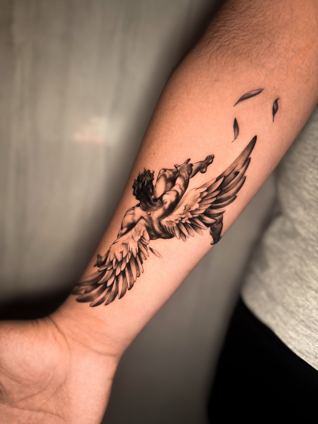 Angel with wings realism tattoo on the forearm by Montreal Tattoo Artist