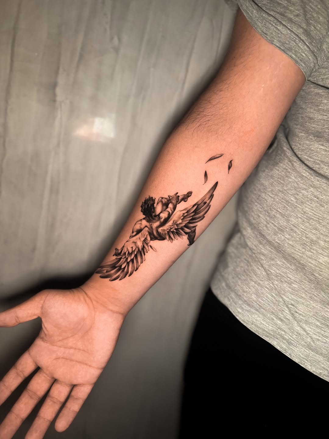 Angel realism tattoo on the forearm by Montreal Tattoo Artist
