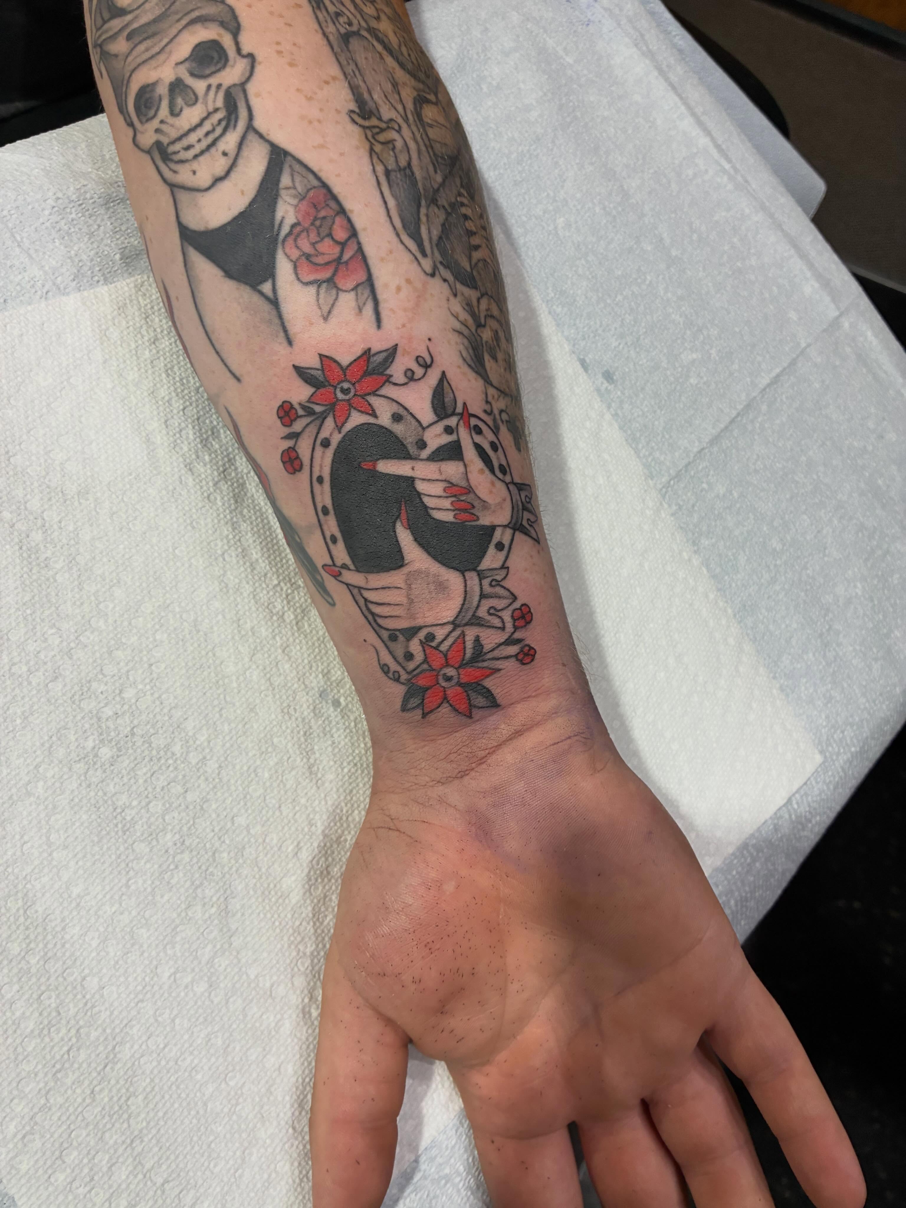 Skull and bird American traditional tattoo on the forearm by Natalie Spuhler