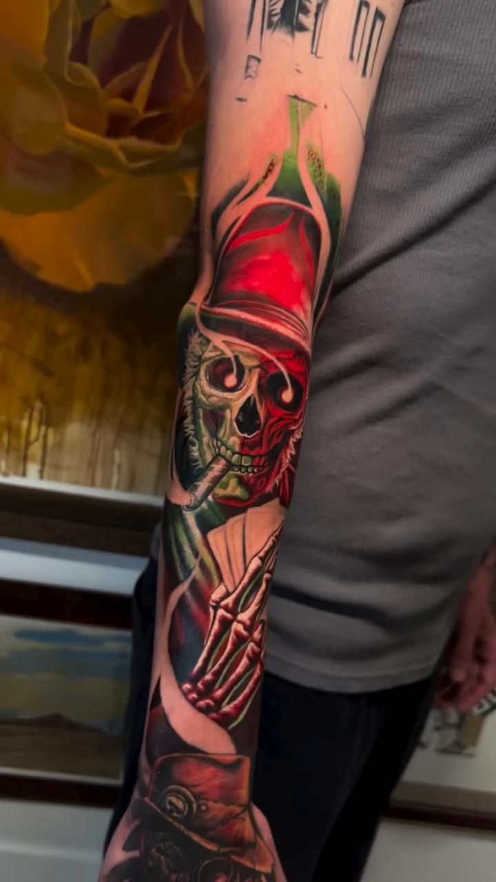 Dark art tattoo on the forearm by Sam Neer