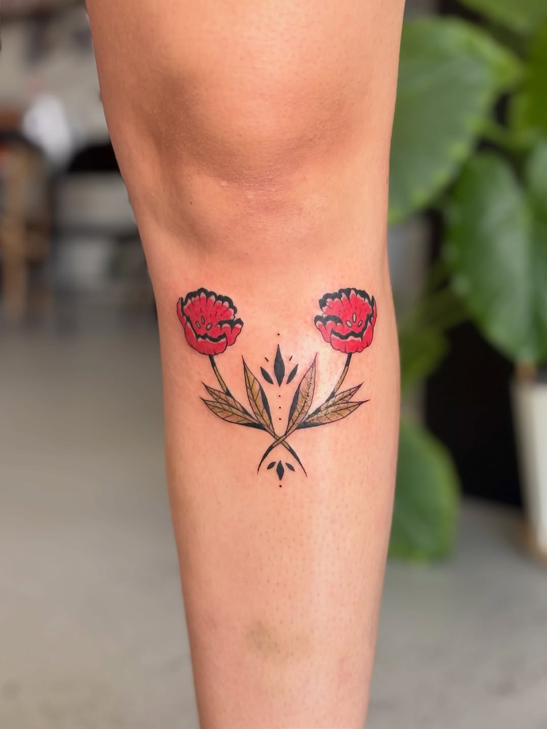 Two poppies with leaves neo-traditional tattoo on the forearm by Kate Behr 🌱