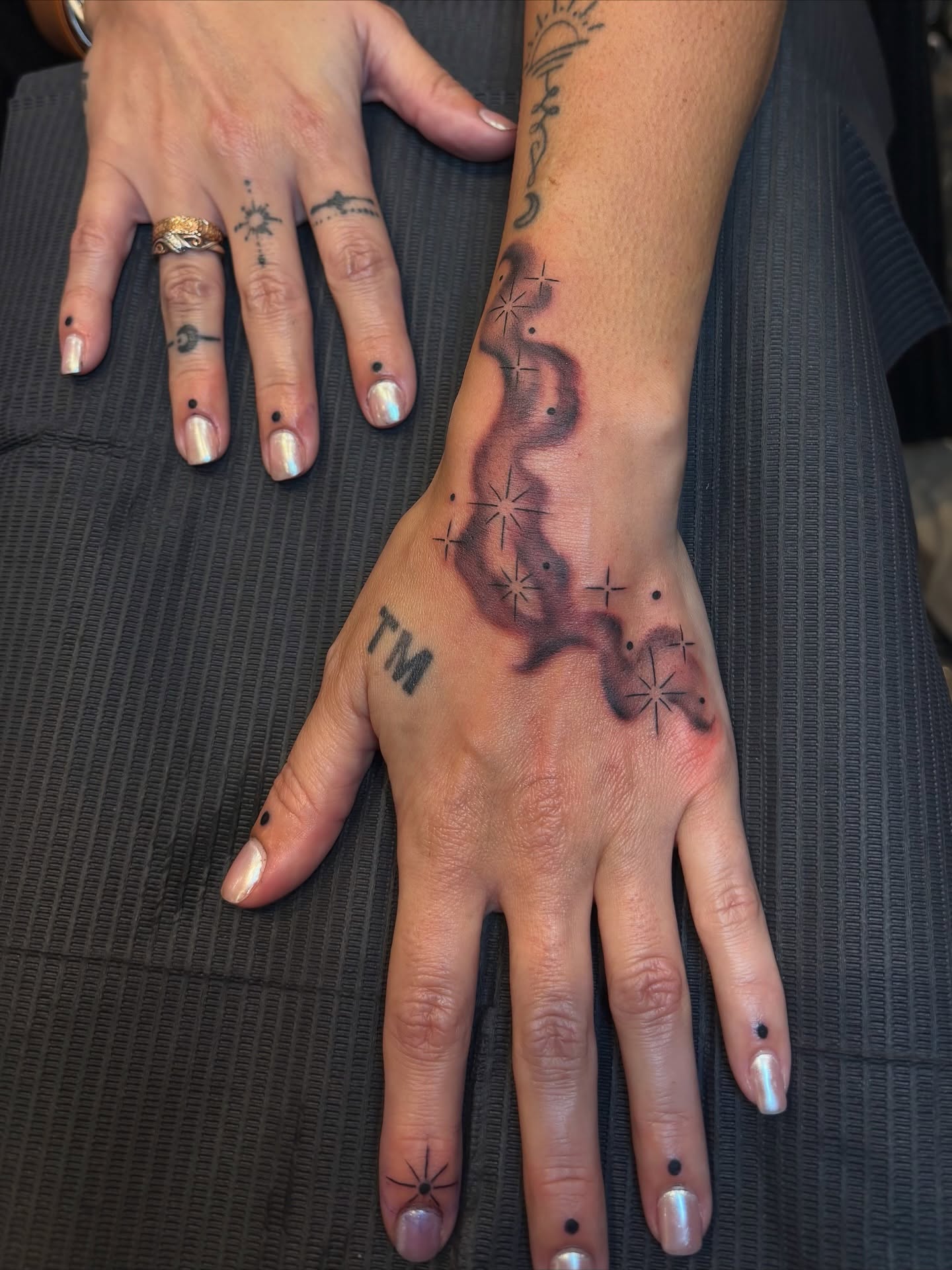 Abstract design dotwork tattoo on the hand by Shiann Null