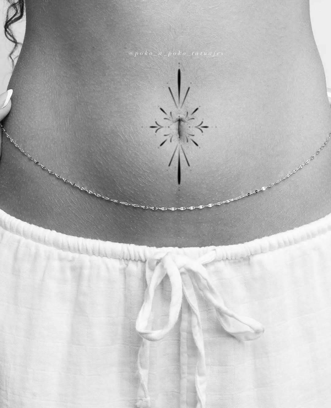 Geometric starburst tattoo on the torso by @ethereal.ornamentalism