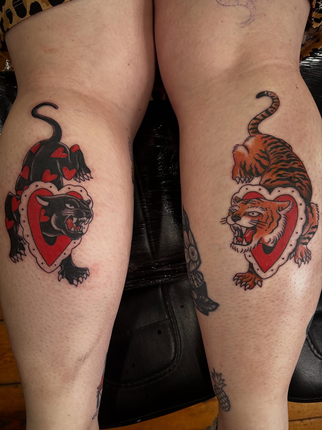 Panther and tiger with hearts realism tattoo on the thigh by manda, Lebanon, Ohio