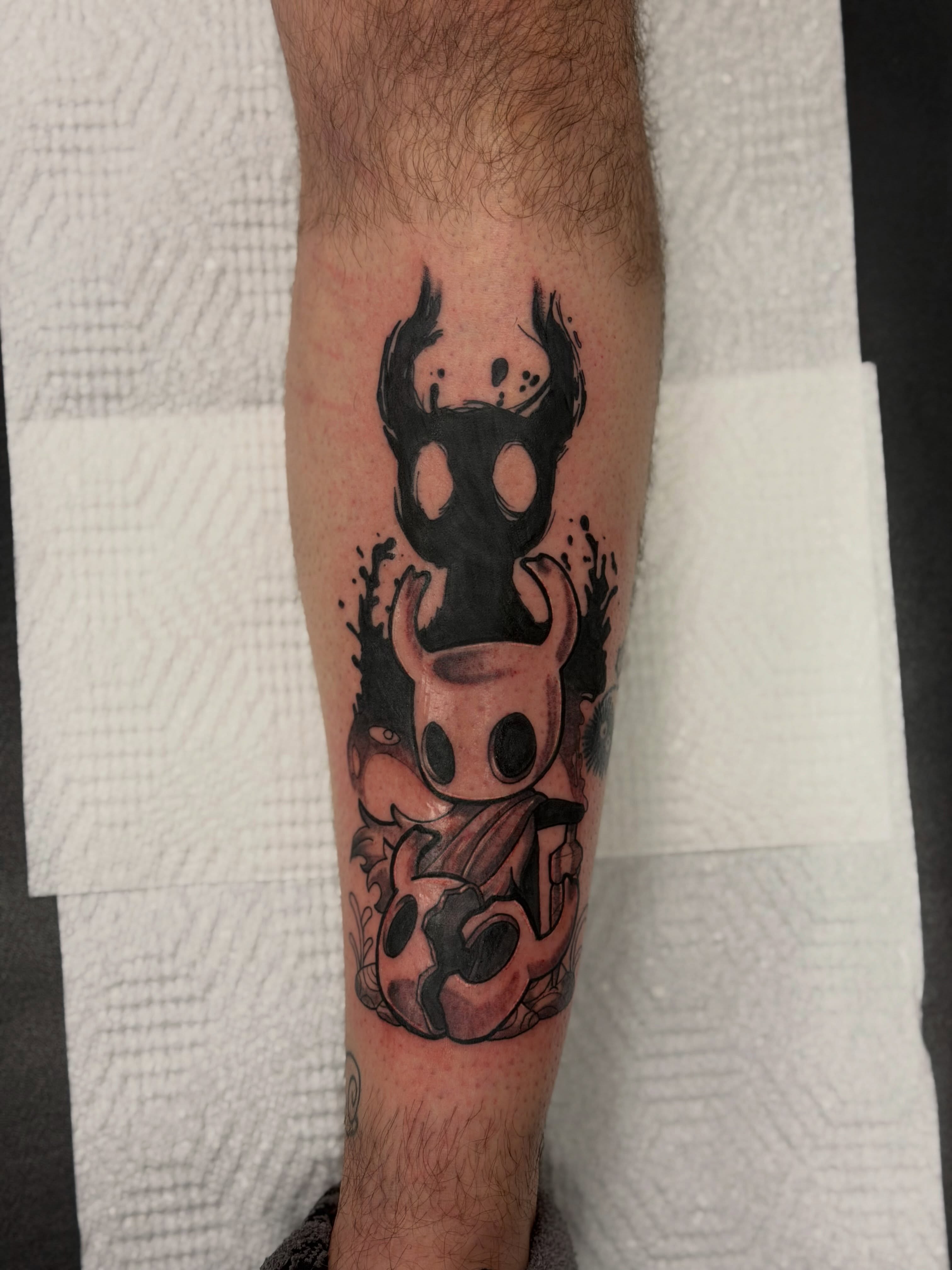 Mask and creature black and grey tattoo on the forearm by Cameron 🩸👻