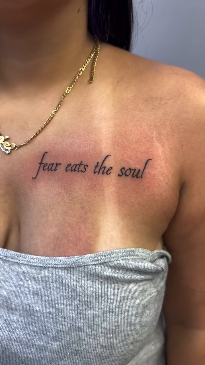 Fear eats the soul text tattoo lettering tattoo on the chest by 𝕽𝖆𝖈𝖍𝖊𝖑 𝕽𝖆𝖉𝖎𝖈𝖆𝖑 Queens Tattooer
