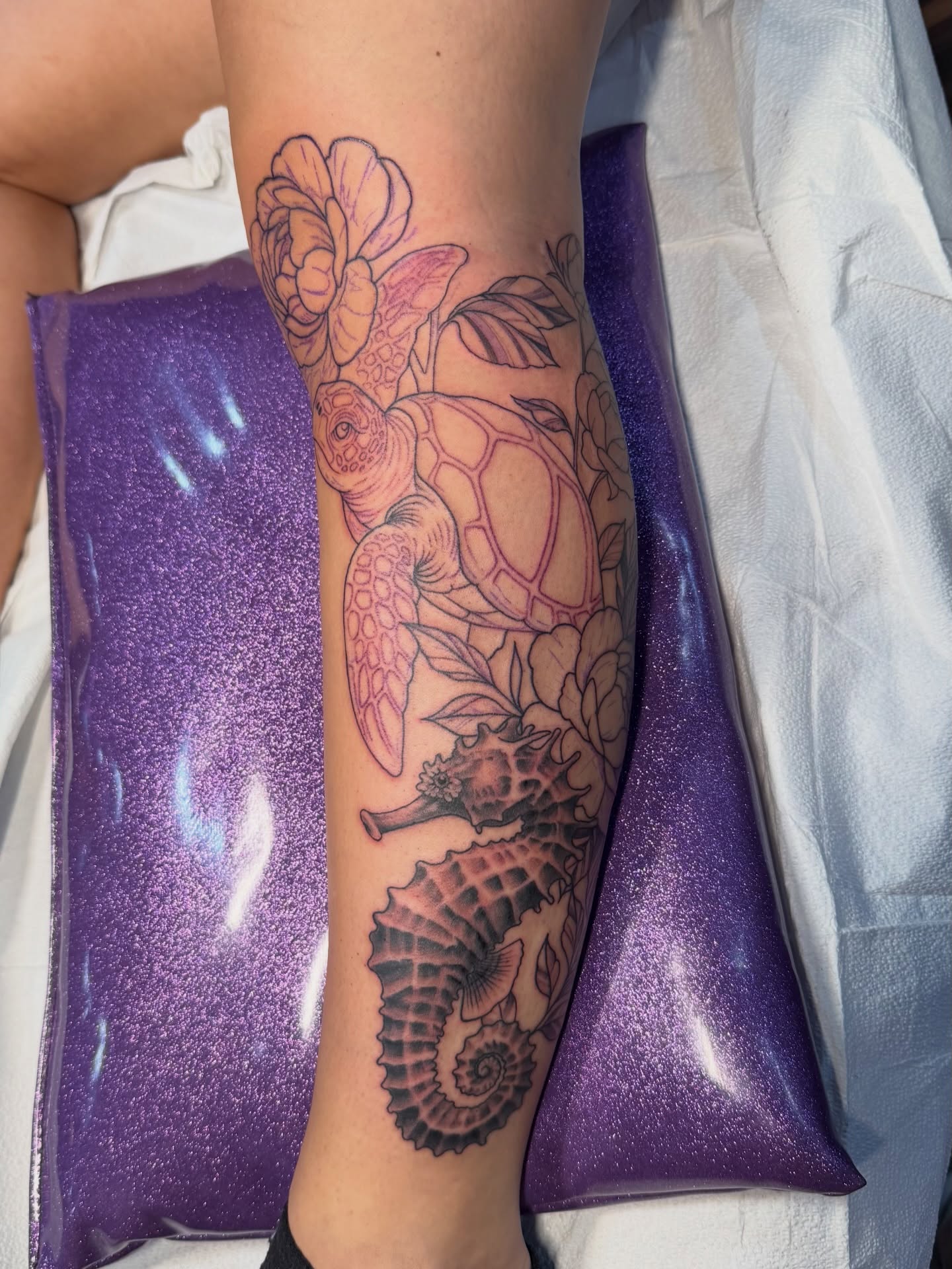 Sea turtle and seahorse realism tattoo on the forearm by TyAnne Schulte