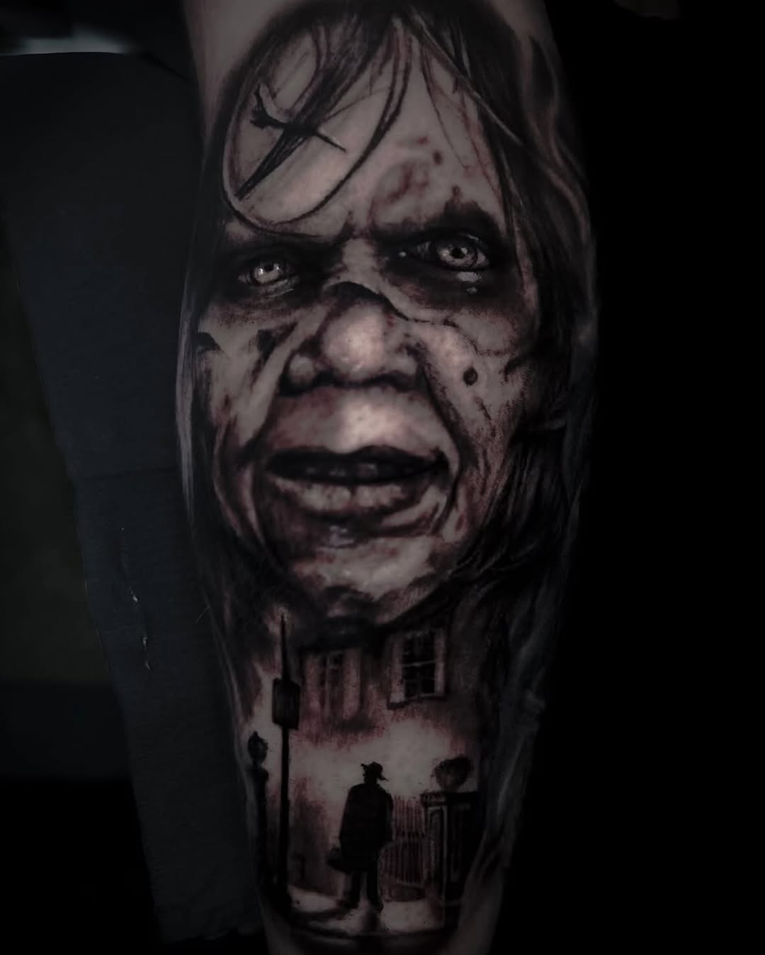 Horror movie character and street scene realism tattoo on the forearm by Brooke Kresco