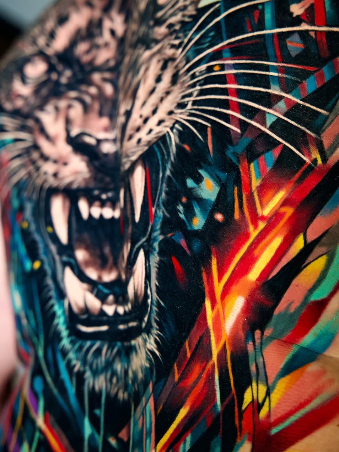 Tiger face with abstract background watercolor tattoo on the torso by Israel De Jesus Legonier Aguliera