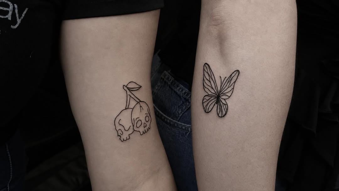 Skull cherries and butterfly fine line tattoo on the forearm by rylie :P