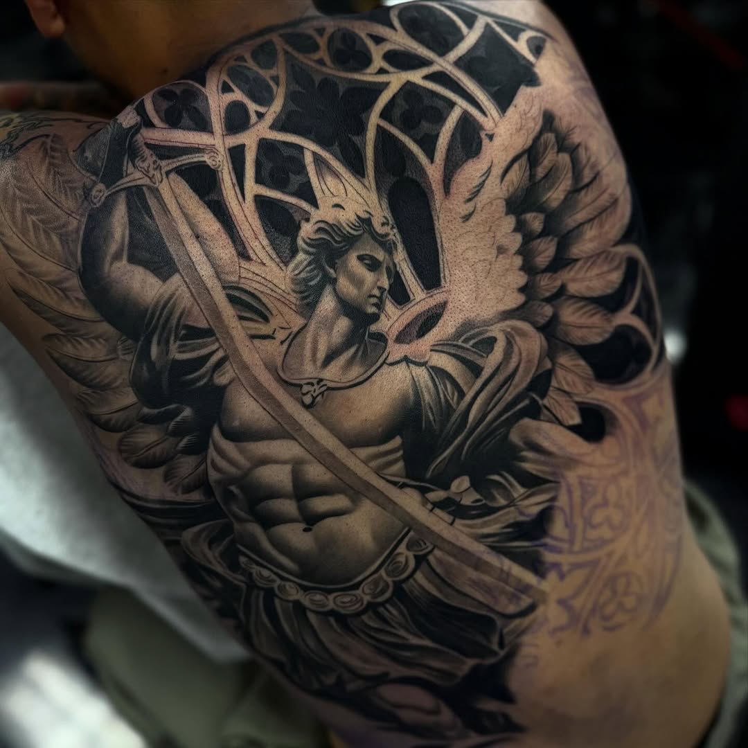 Tattoo by @angel_damiangg — realism, black_and_grey