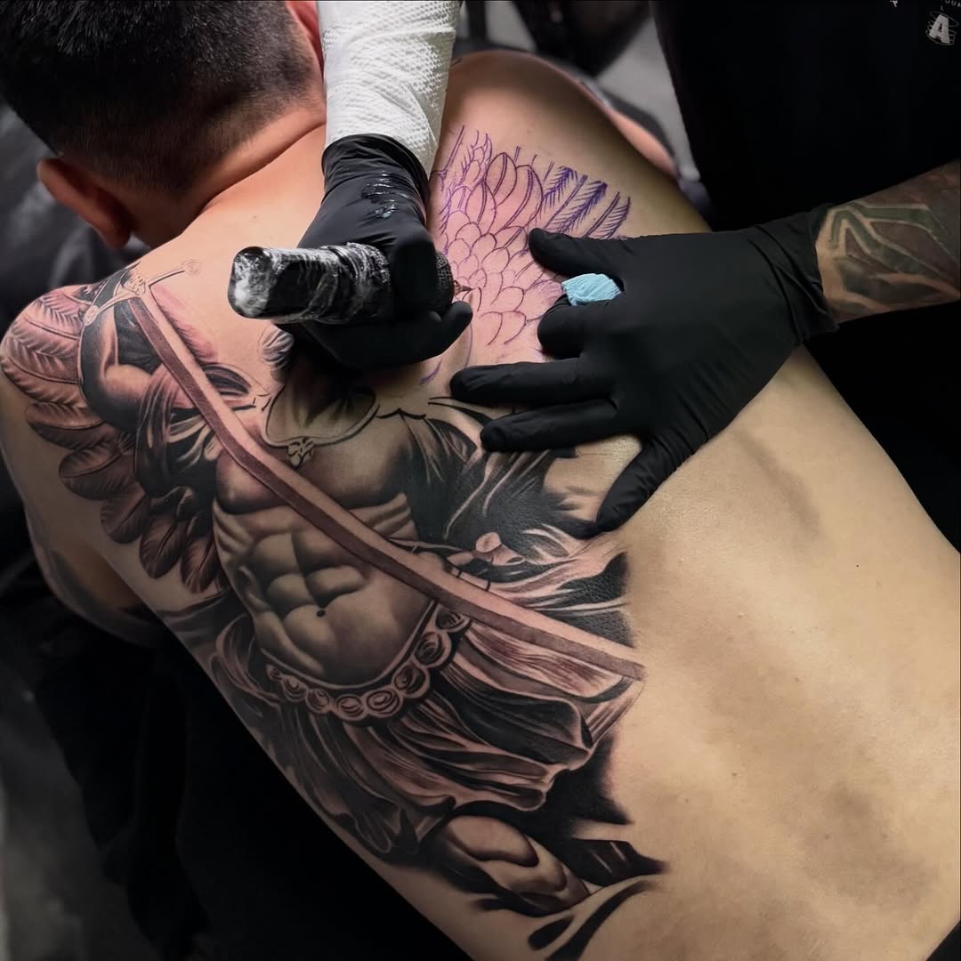 Tattoo by @angel_damiangg — realism, black_and_grey