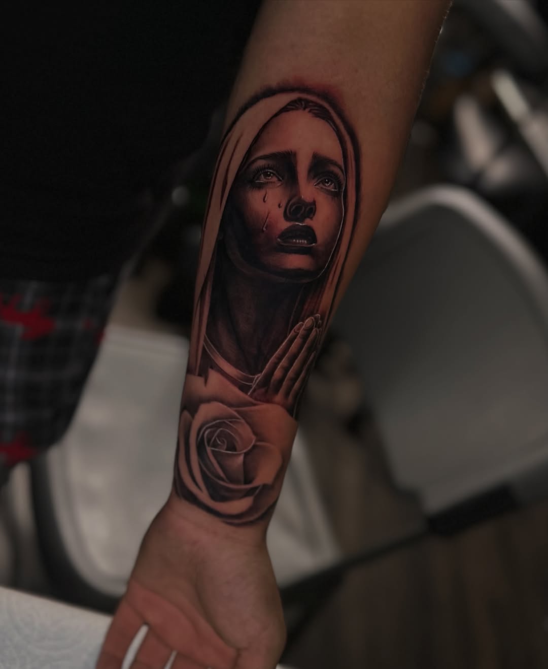 Virgin Mary and rose Chicano tattoo on the forearm by Mando