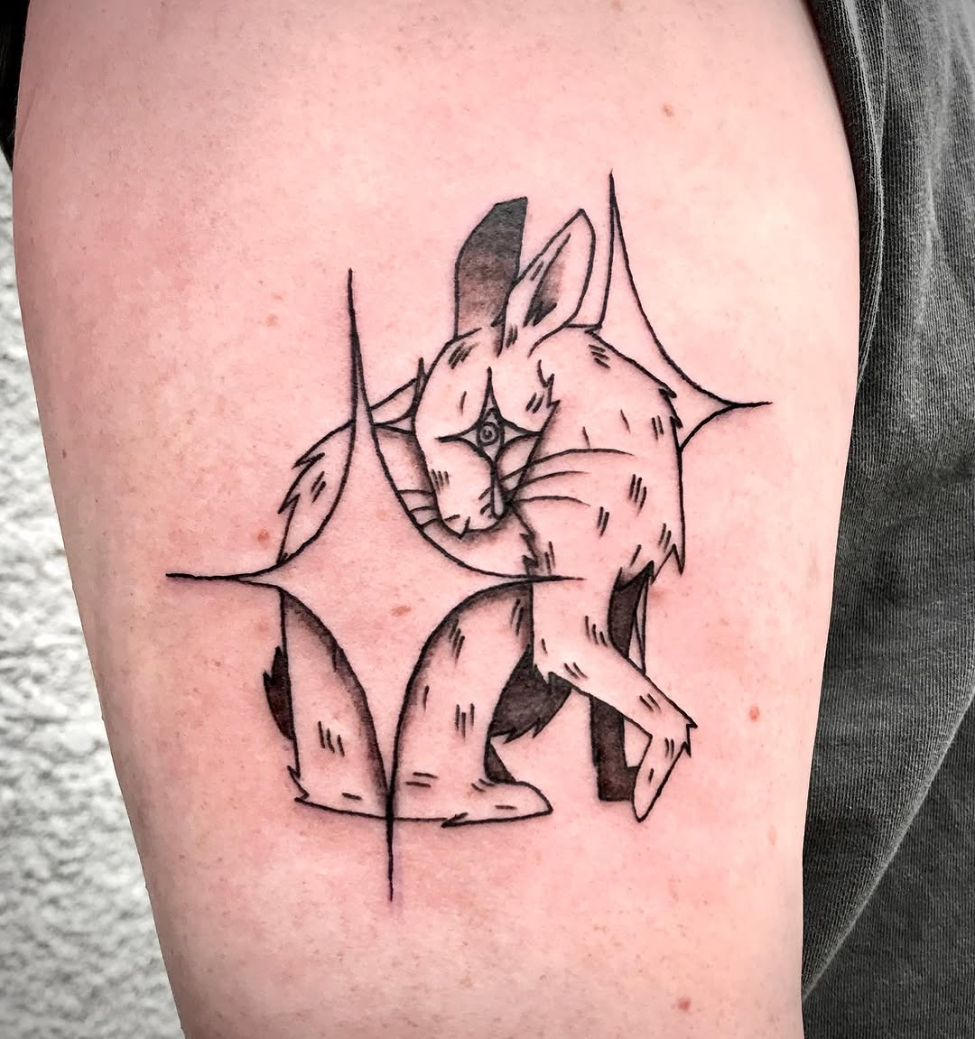 Stylized rabbit fine line tattoo on the thigh by Karson