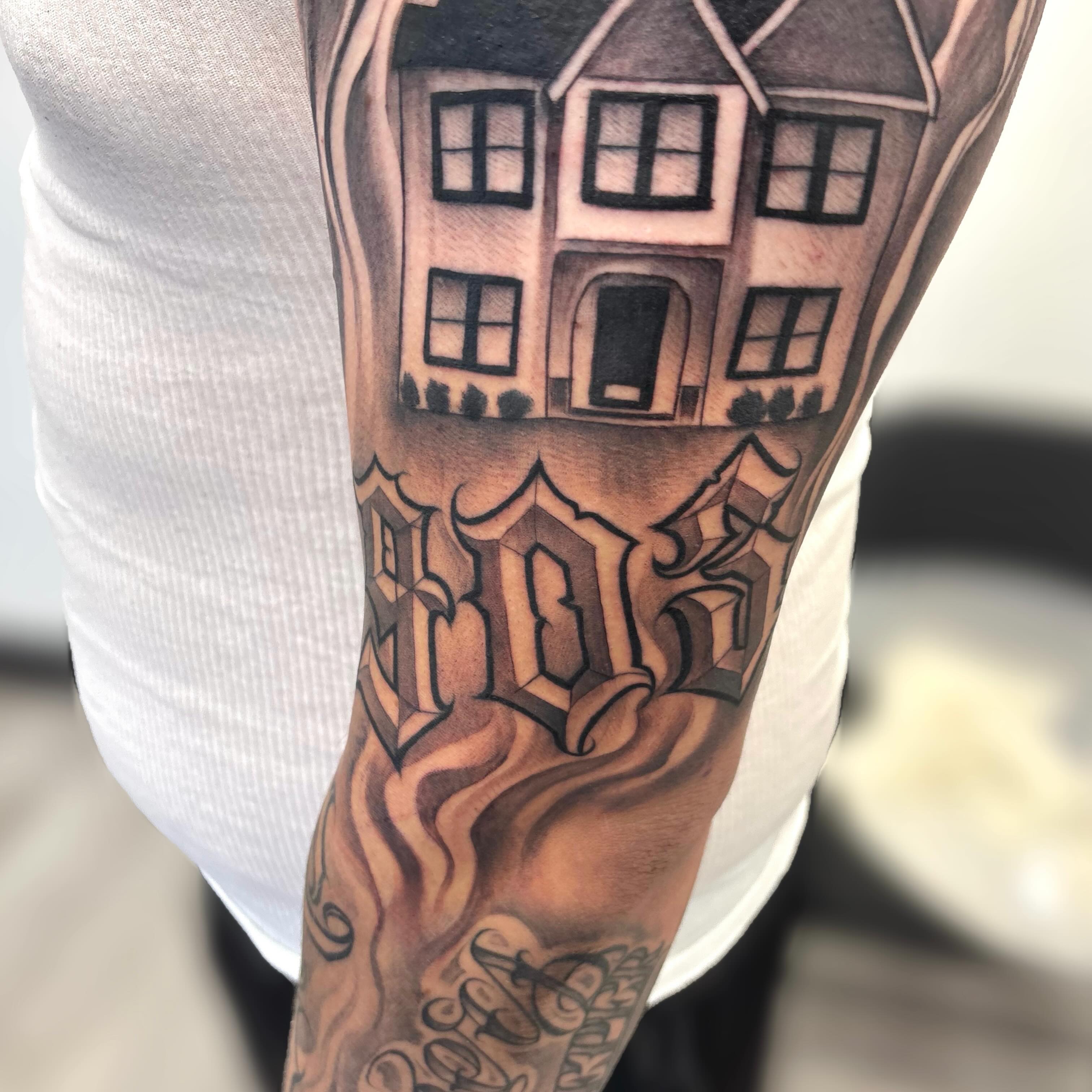 Haunted house realism tattoo on the forearm by Dallas Tattoo Artist