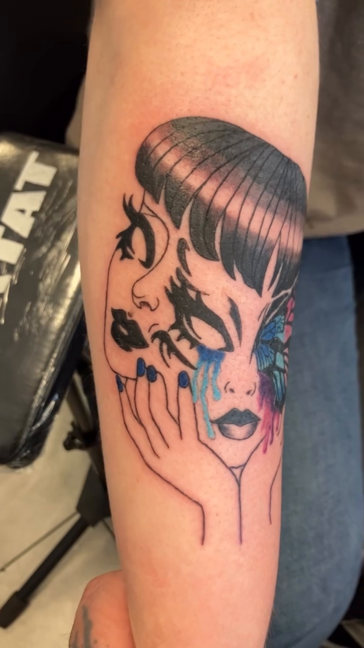 Surreal portrait with butterfly realism tattoo on the forearm by Bryant Johnson