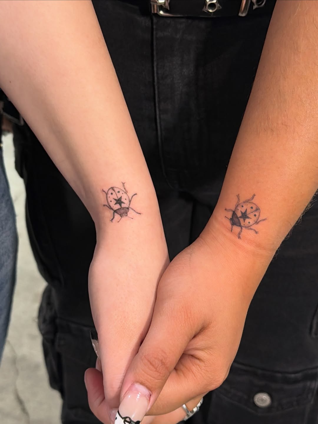 Ladybug minimalist tattoo on the forearm by Sienna (jj) Hicks