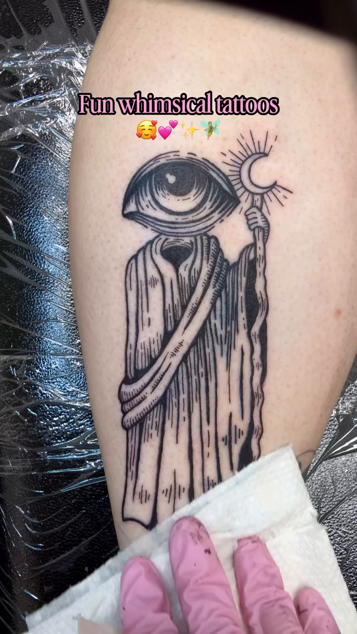 Grim reaper with an eye surrealism tattoo on the forearm by Laura🦋