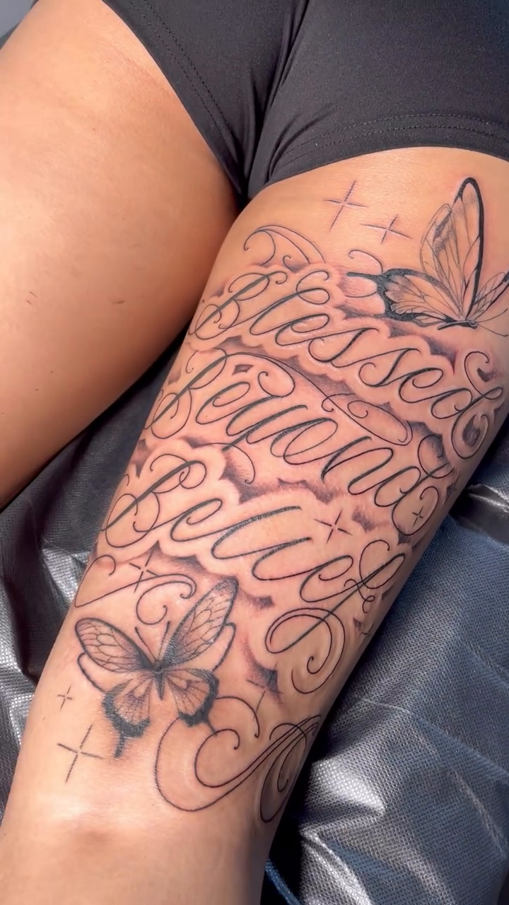 Blessed Beyond Belief script with butterflies Chicano tattoo on the forearm by christina diaz