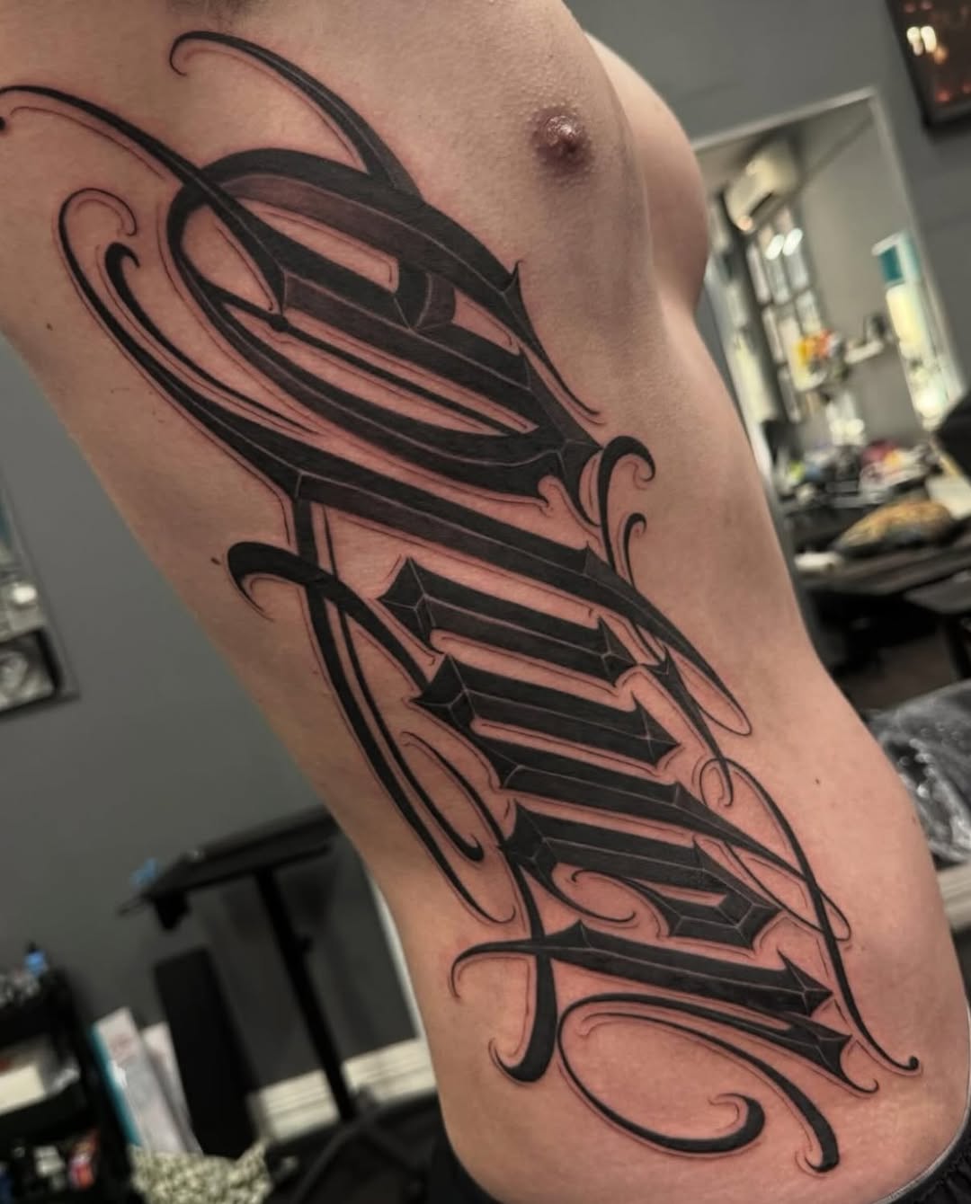 Tattoo by @dopeletterstattoo — lettering_script, blackwork