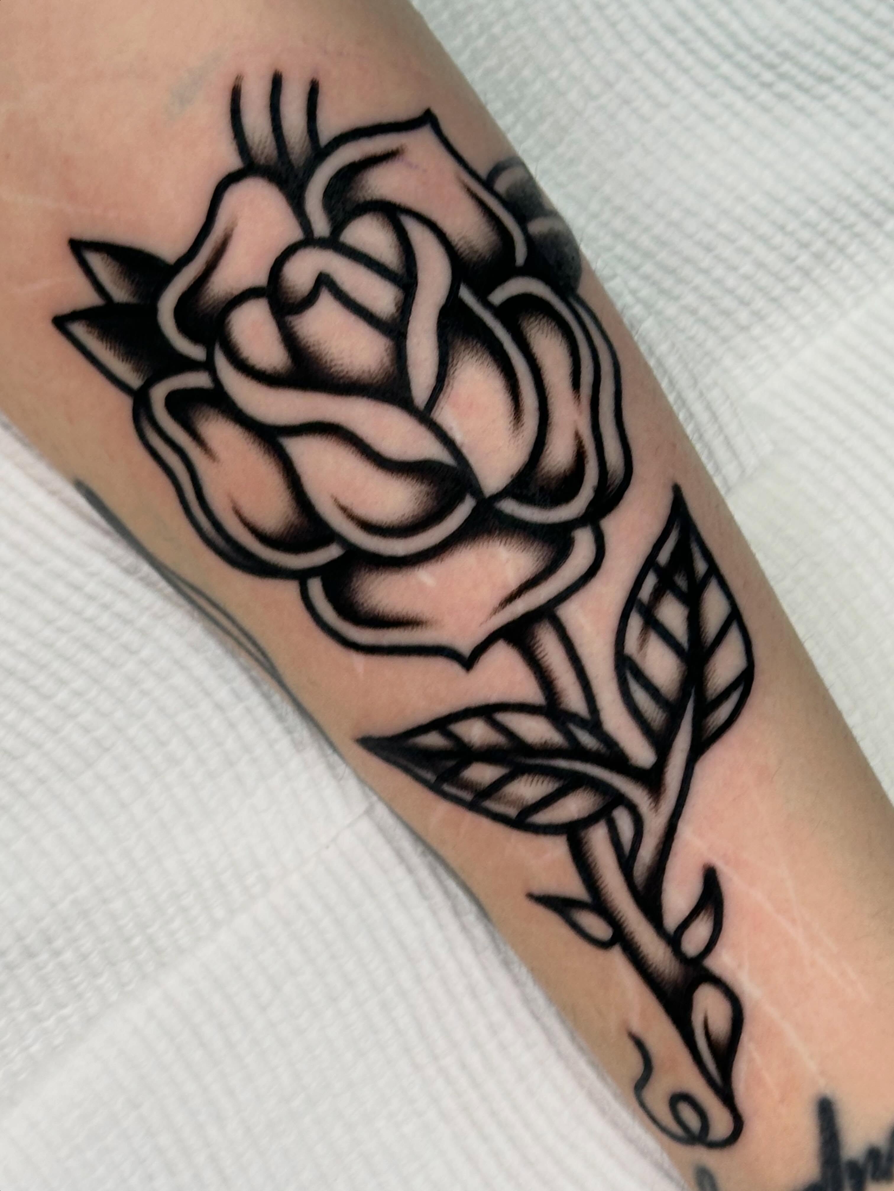 Rose black and grey tattoo on the forearm by 쿤타
