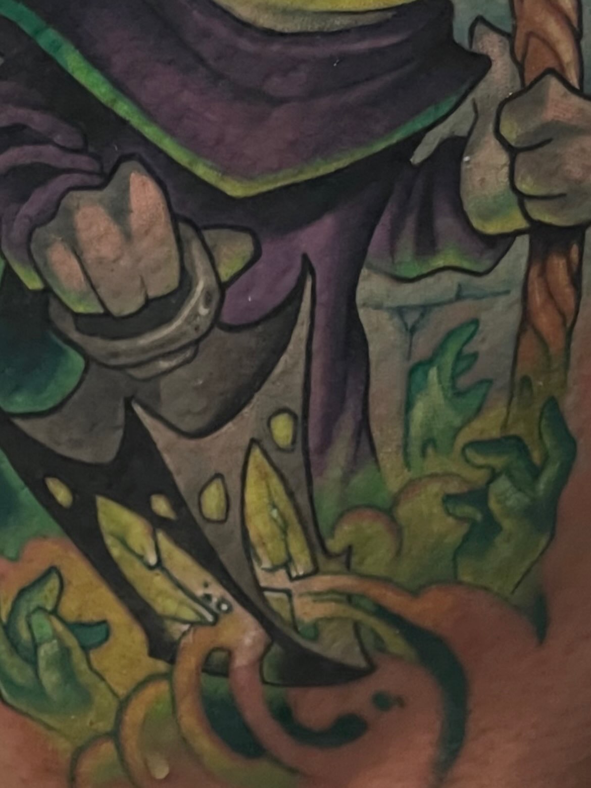 Mask and vines watercolor tattoo on the forearm by Tatgunjoe, Salt Lake City, Utah