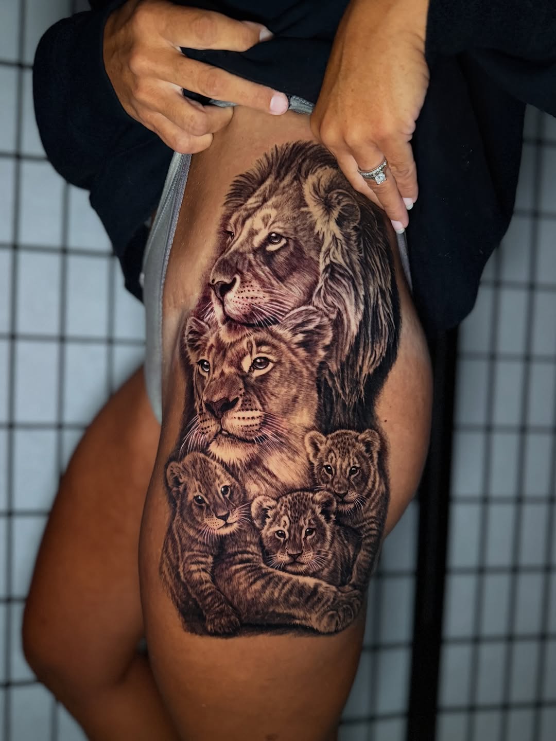 Lion family realism tattoo on the thigh by Anthony Ramirez