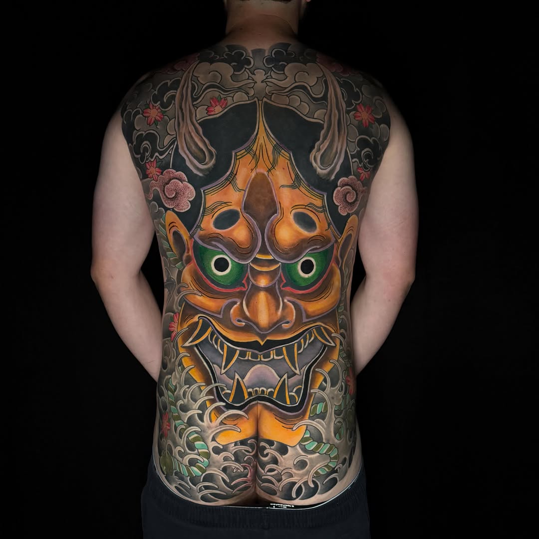 Hannya mask with clouds and waves Japanese tattoo on the back by Mark Thompson, Dallas, Texas