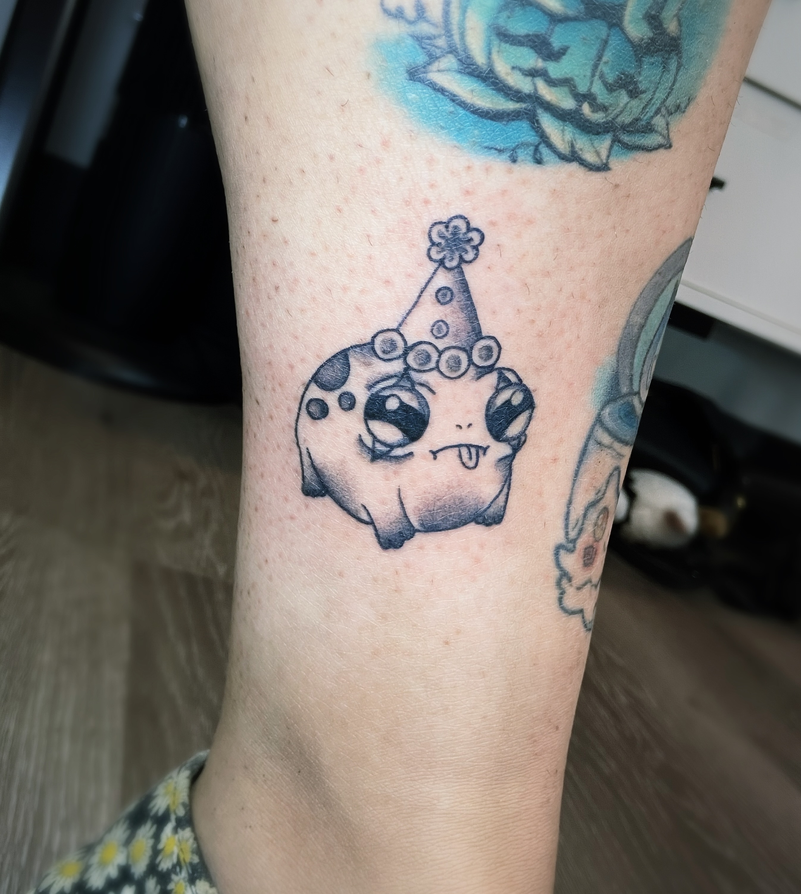 Party hat dotwork tattoo on the forearm by Shay Cole