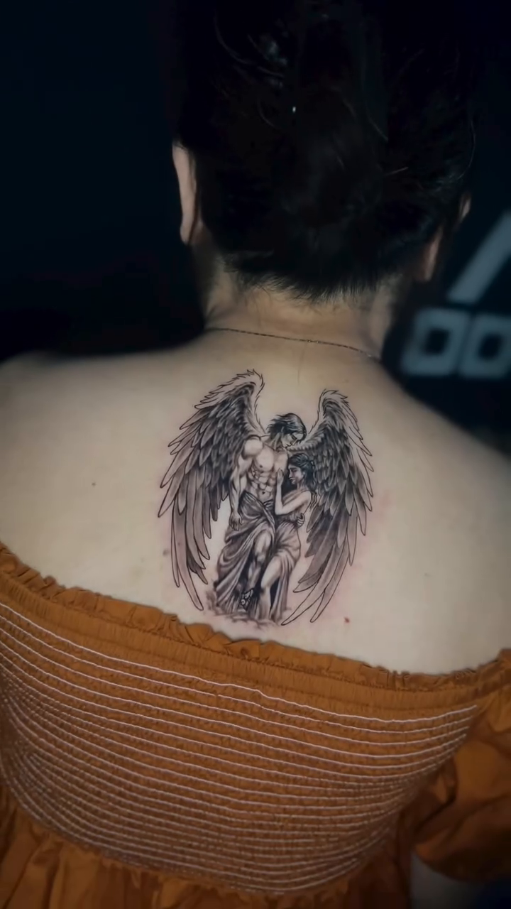 Angel and text tattoo realism tattoo on the back by Stephen Degracia