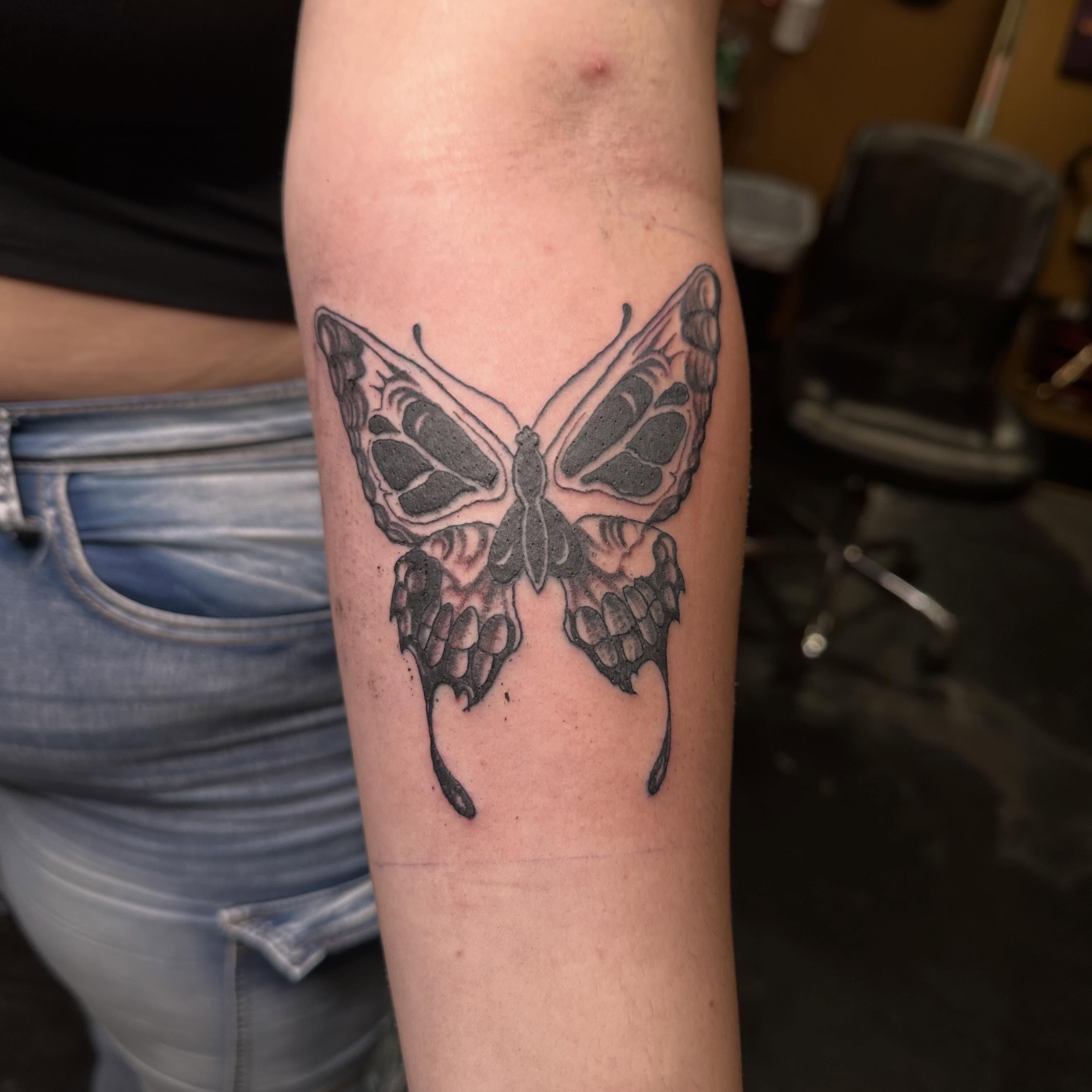 Butterfly black and grey tattoo on the forearm by Red (Owner), Brooklyn, New York