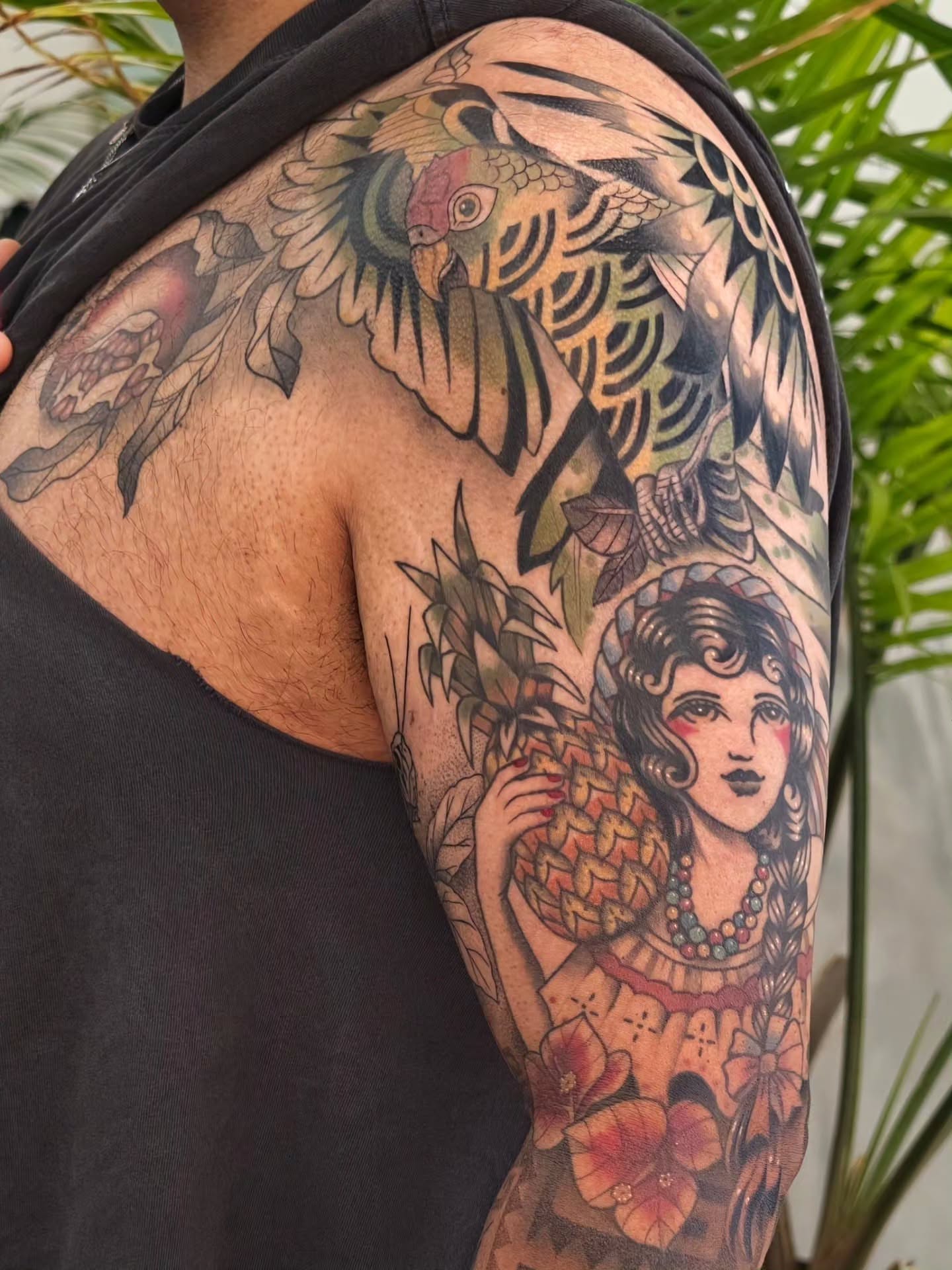 Woman with pineapple American traditional tattoo on the upper arm by Jess Dominguez