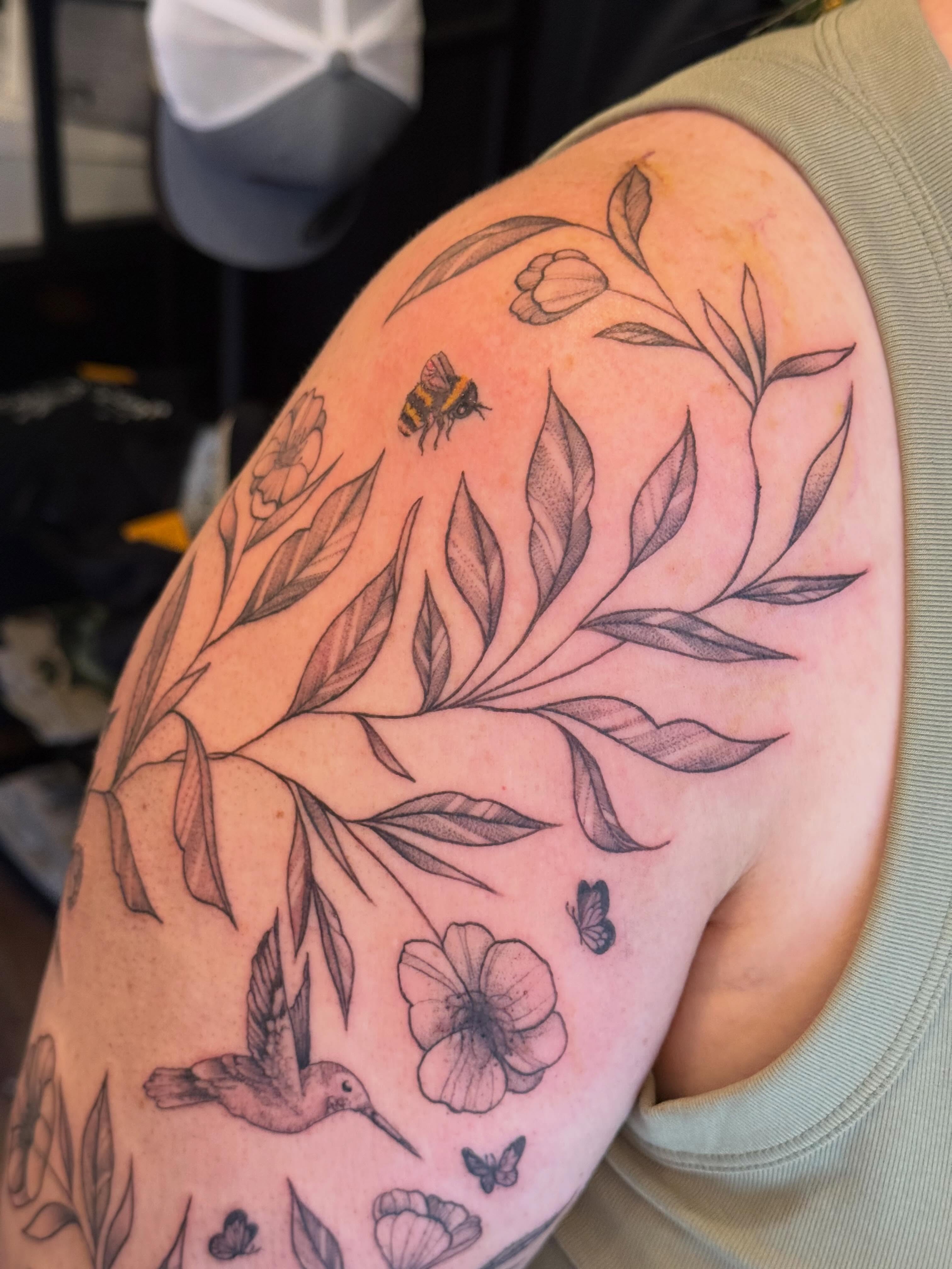 Botanical black and grey tattoo on the shoulder by Lauren Horness