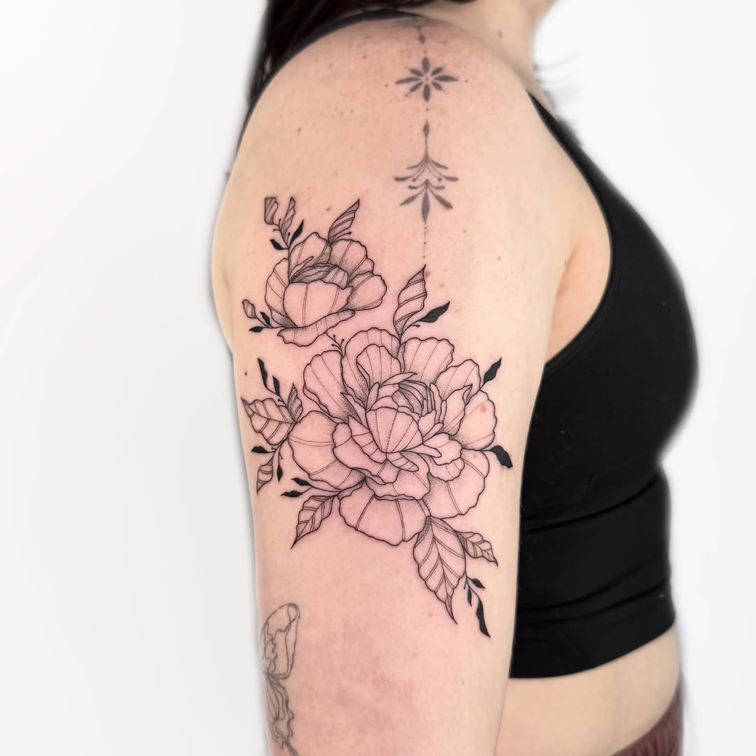 Peonies and leaves fine line tattoo on the shoulder by Nika