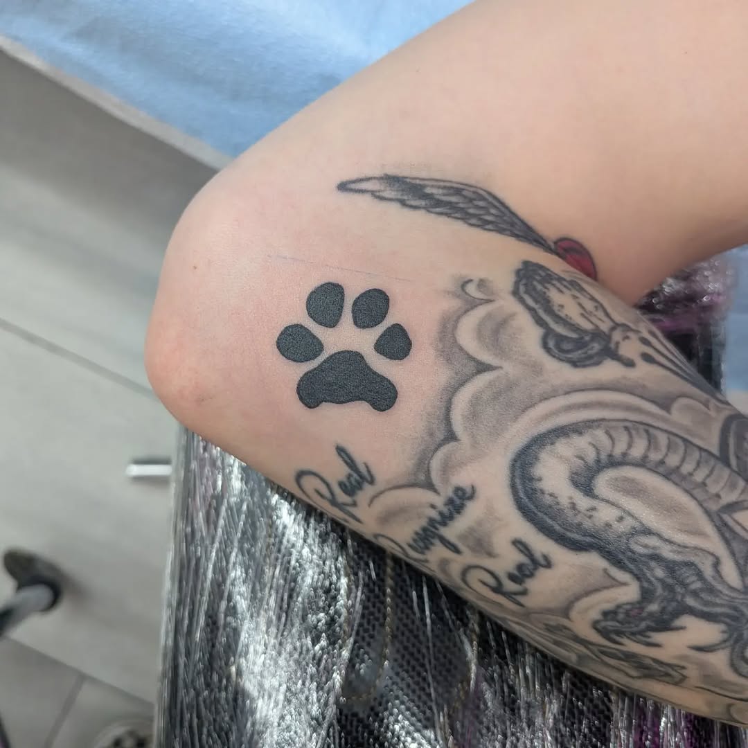 Paw print realism tattoo on the forearm by Damon 🥀