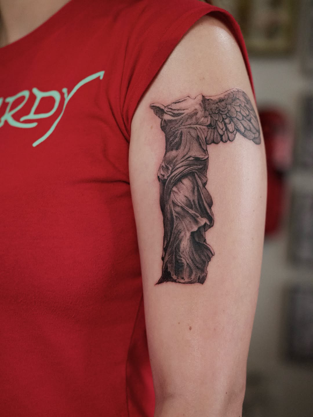 Winged Victory of Samothrace statue realism tattoo on the forearm by Dylan Coverdale