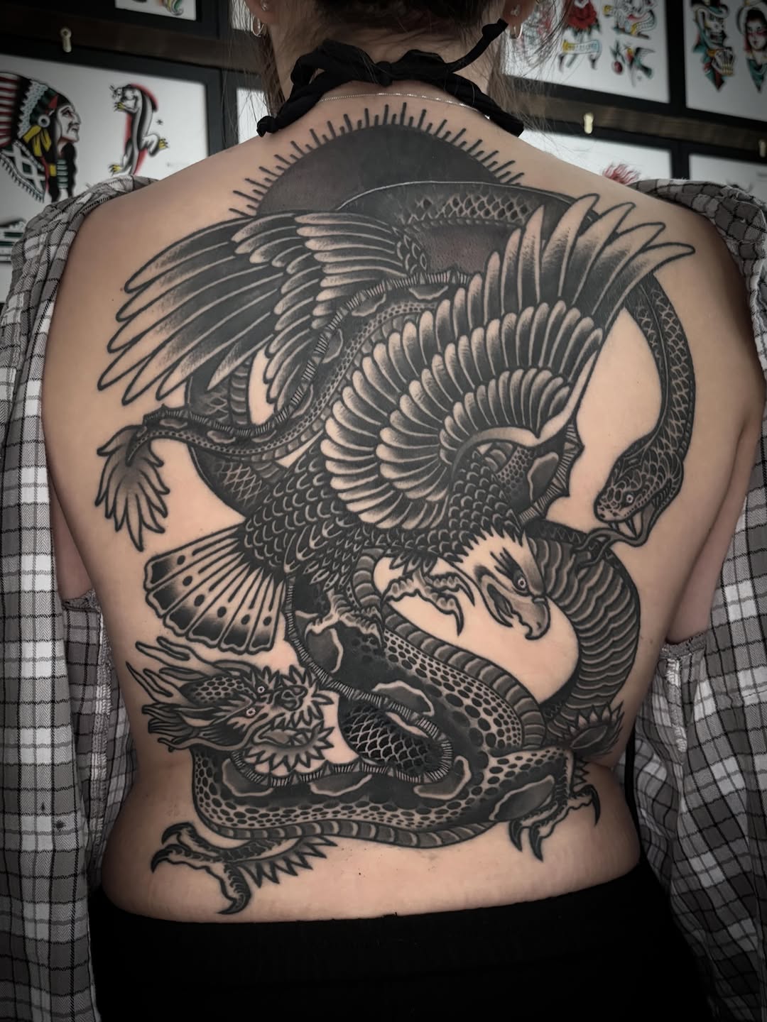 Eagle and dragon geometric tattoo on the back by ๐ป๐๐๐ ๐ณ๐๐๐๐๐๐ ๐๐๐