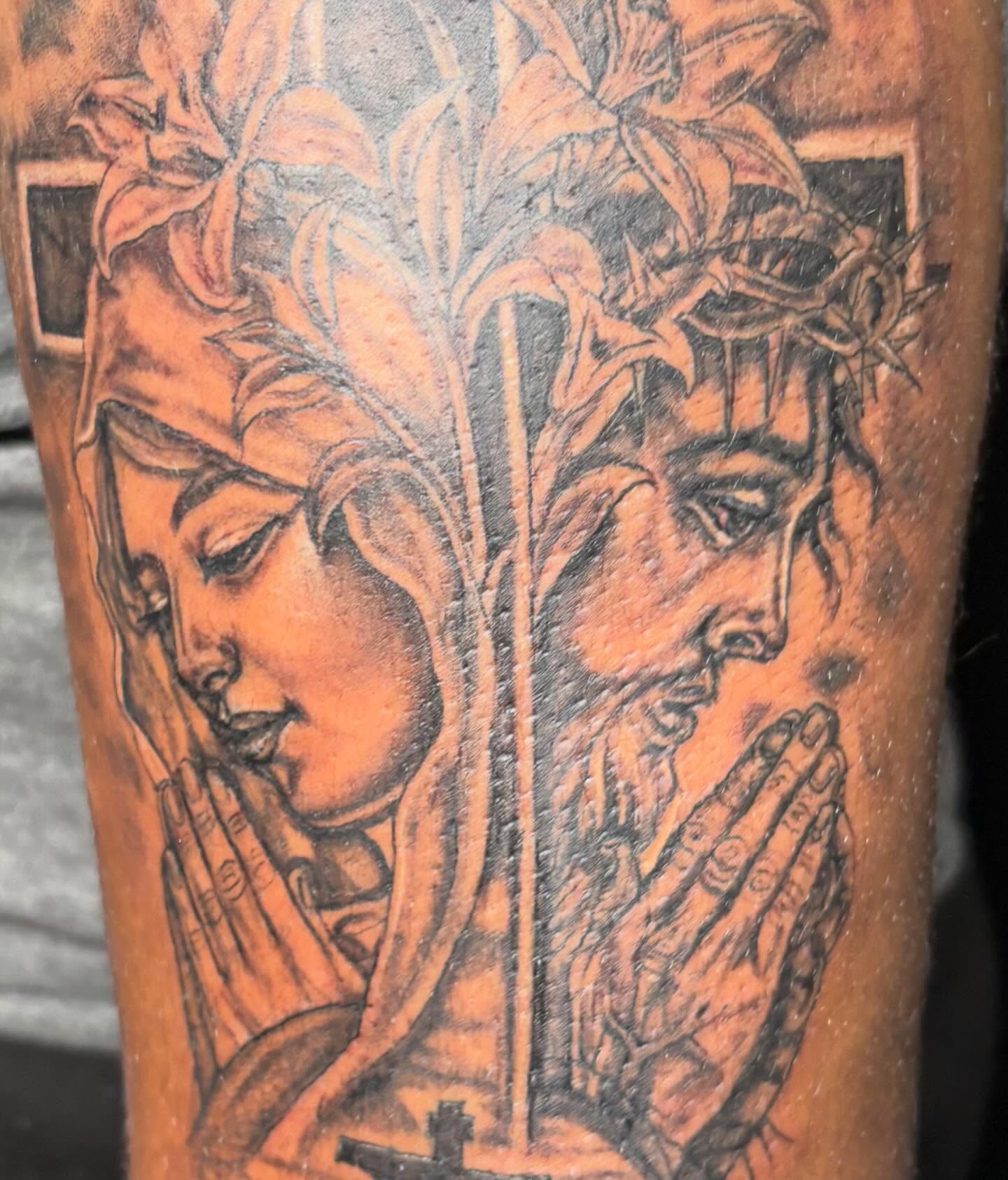 Religious figures praying realism tattoo on the forearm by K.L Tattoo Uptown